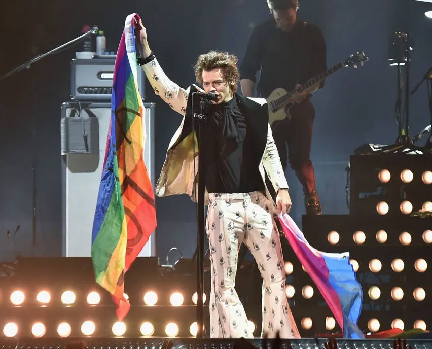 Harry holding rainbow flag